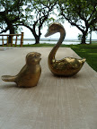 A collection of brass birds was amassed to decorate the tables and bars.