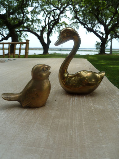 A collection of brass birds was amassed to decorate the tables and bars.