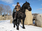 Martha and G.K. love horses! Here they are atop one of Martha's beautiful black Fresians.