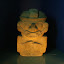 A large carved stone about four feet high, typical of those at San Agustin.