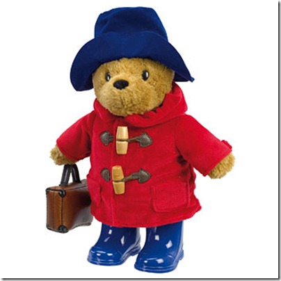 Paddington Bear in duffle coat, suitcase and wellington boots