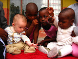 Here's Matimu playing with some of the kids in our host family; those nearest his age. Transition to Madagascar - 102.jpg