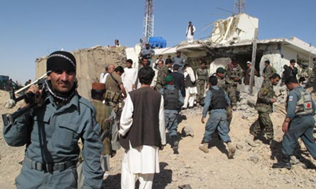 Afghan security forces at the site of a suicide attack in Lashkar Gah, capital of Helmand province. AFP / Getty Images