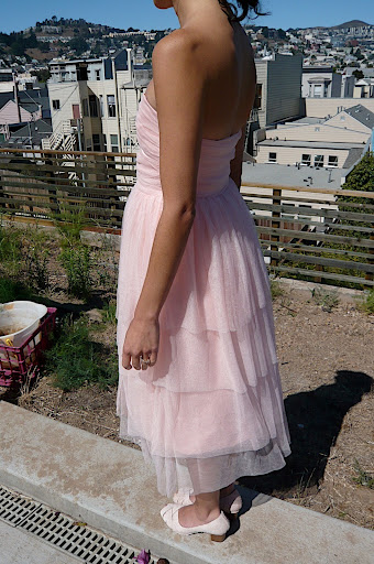 The bride's blush-pink dress was so delicate and feminine.