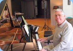 Jim Nicholson playing the grand piano. Photo courtesy of Dennis Lyons.