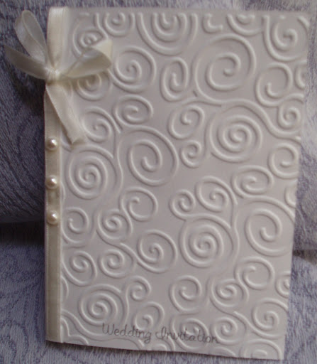 Hand Embossed Swirls with pearl Embellishments and a Soft Satin Ribbon