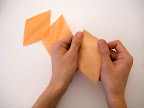 Stretch out the paper for each petal by tugging lightly across the grain.