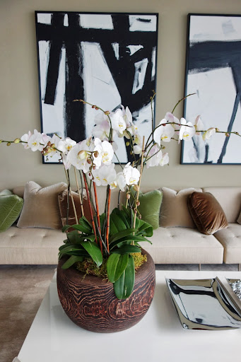 This antique Japanese hibachi is filled with Phaleonophsis Orchids and while they are not my favorite flower, they do last forever. This antique Japanese hibachi is filled with Phaleonophsis Orchids and while they are not my favorite flower, they do last forever.