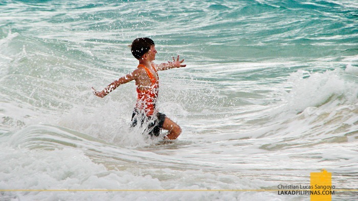 A Kid Playing Along Boracay's Strong Waves