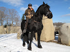 Hey, wait a minute!  Martha, we were setting the ground rules for this new pup and look what you've gone and done!  Ghenghis Khan will start to feel superior to us if you treat him so well!  I know that Ghenghis Khan, the Mongolian, was quite a horsebak rider but, this is ridiculous!