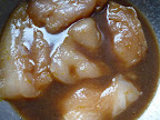 Chicken marinating in soy-ginger mix.