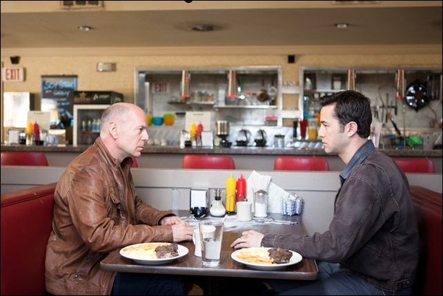 Bruce Willis and Joseph Gordon-Levitt as "Joe" in TriStar Pictures, Film District, and End Game Entertainment's action thriller LOOPER.