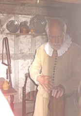Plimoth Plant older pilgrim man inside house Plimoth Plant older pilgrim man inside house