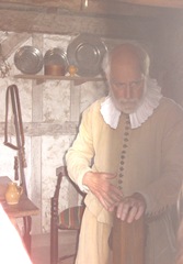 Plimoth Plant older pilgrim man inside house