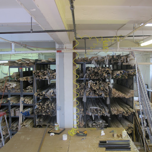 Frames are laid horizontally, waiting to be custom constructed.