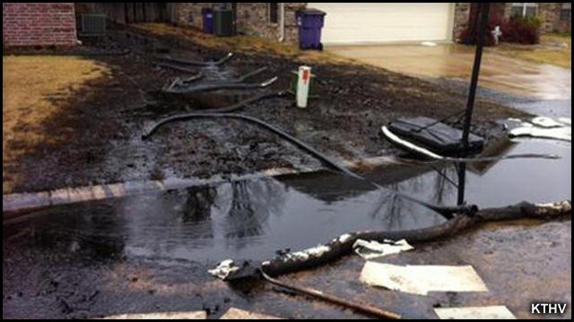 Heavy oil from the Athabasca tar sands mine in Alberta, Canada, flows through a neighborhood in in Mayflower, a small city about 20 miles northwest of Little Rock, Arkansas, after a 22-foot-long section of ExxonMobil's Pegasus pipeline split open on 1 April 2013. Photo: KTHV