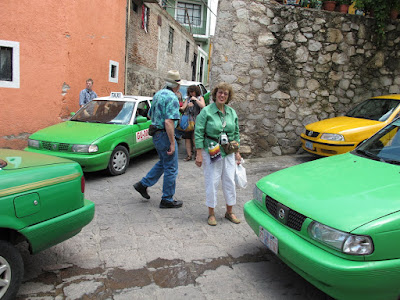 Carole surrounded by green