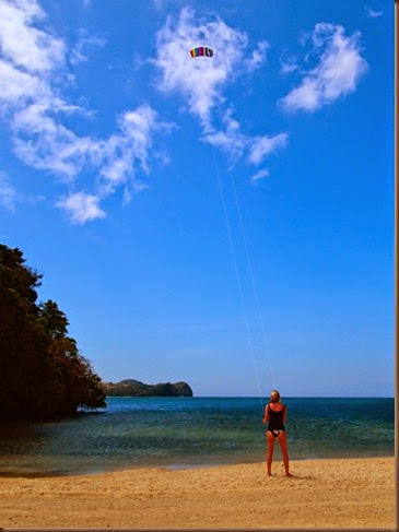 flying a kite on a private beach phillippines