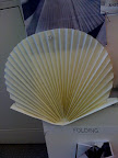 This was a mock-up we made to help us configure the pleated invitation. We eventually decided to make it a perfectly round circle rosette.