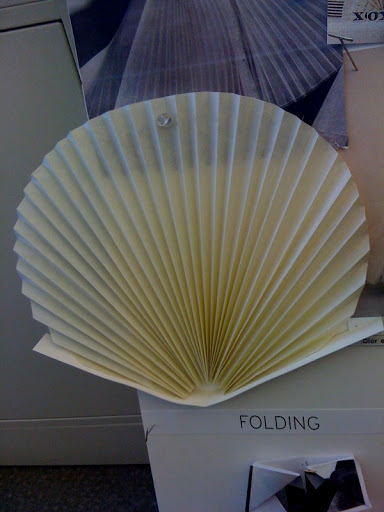 This was a mock-up we made to help us configure the pleated invitation. We eventually decided to make it a perfectly round circle rosette.