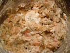 Chunks of fresh salmon have been added and pulsed until some chunks remain.