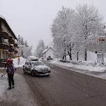 peugeot driving through the street in the snow in Seefeld, Austria 