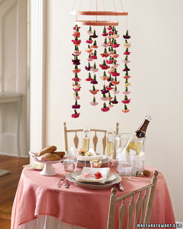 Get creative with the space around your table by adding a hanging carnation mobile. Keep it grounded with matching napkin rings. Get creative with the space around your table by adding a hanging carnation mobile. Keep it grounded with matching napkin rings.