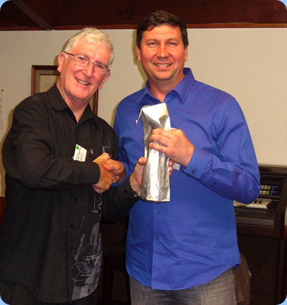 Club President, Gordon Sutherland, giving Vladimir Shilov a drop of Kiwi 'vodka' as a thank you for a splendid concert. Photo courtesy of Club Secretary, Colleen Kerr.