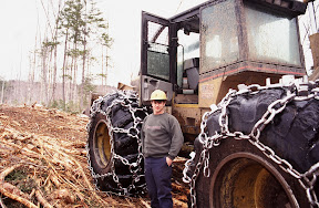The Dirty Hands People - Twenty-one-year-old Dennis Walter pauses beside a skidder he was operating for a logging company in Maine in the summer of 1998. Mr. Walter said he hoped to make logging his life's work. But the Northeast's pulp and paper industry now faces the worst market conditions in anyone's memory. Hundreds of loggers have lost their jobs or parked their equipment in hopes of better days.