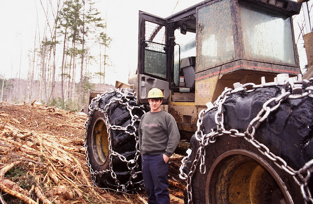 The Dirty Hands People - Twenty-one-year-old Dennis Walter pauses beside a skidder he was operating for a logging company in Maine in the summer of 1998. Mr. Walter said he hoped to make logging his life's work. But the Northeast's pulp and paper industry now faces the worst market conditions in anyone's memory. Hundreds of loggers have lost their jobs or parked their equipment in hopes of better days.