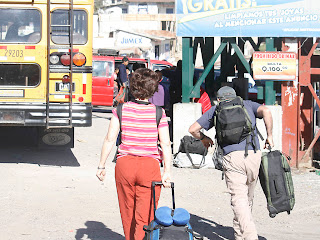 Dave sprinting for the Chicken bus. Either Betsy knows there's always another one or she isn't as quick as he is. Photos by TOM HART