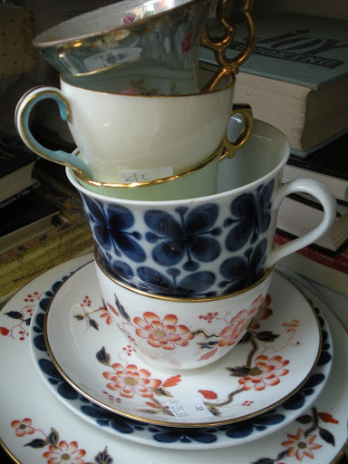 There's something so whimsical about tea-cups stacked this way. I love the mixture of colors and patterns.