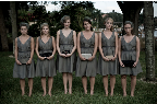 The bridesmaids, in their gray dresses and birdcage veils. Here, they hold the clutches they carried down the aisle (in lieu of bouquets). The bridesmaids, in their gray dresses and birdcage veils. Here, they hold the clutches they carried down the aisle (in lieu of bouquets).
