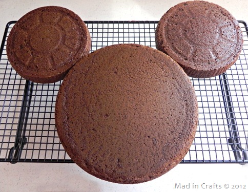 three circular cakes in the shape of a Mickey head