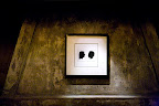 A framed print of the silhouettes hung on the fireplace inside. A framed print of the silhouettes hung on the fireplace inside.