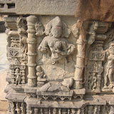 Brahmani, shakti of Brahma. Shown with three heads, and her mount, hamsa (swan), is shown at the base. Presence of Brahmani may point to the presence of Sapta-matrikas in the temple, however I did not see such an arrangement here.