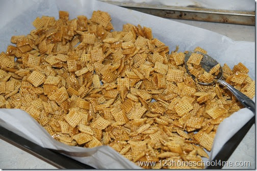 Toss cereal square with carmel snack mix Toss cereal square with carmel snack mix