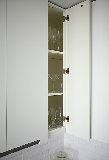 On both sides of the kitchen, there are the deep narrow corner cabinets. Martha and I thought they were perfect for storing my stemware. On both sides of the kitchen, there are the deep narrow corner cabinets. Martha and I thought they were perfect for storing my stemware.