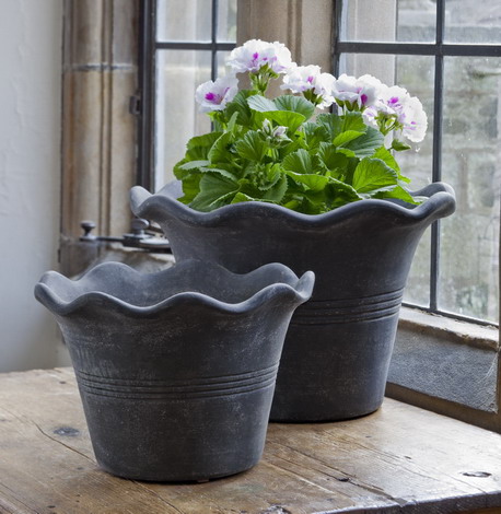 The wavy edges on these pots create a whimsical, feminine effect. (campaniainternational.com)