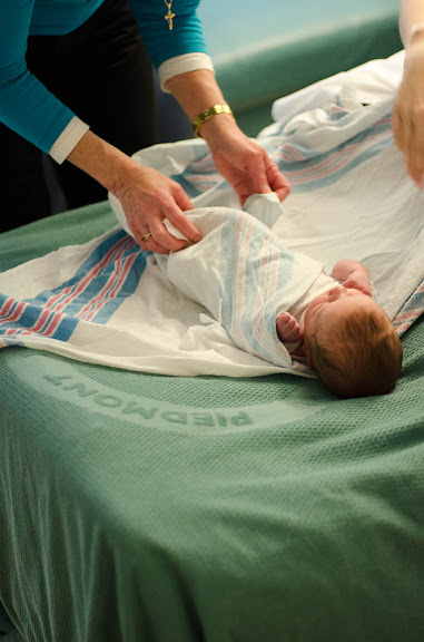 getting swaddled by Honey.