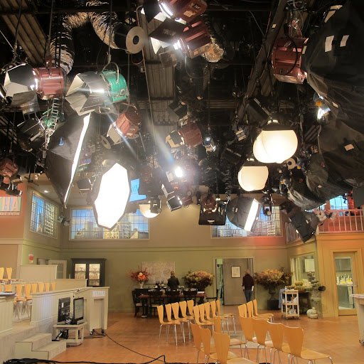 This image gives you a pretty good idea of all the nuts and bolts that turn a studio into a stage. These lights are the reason you absolutely must wear TV makeup when shooting.