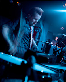 Tres punishing his drums...