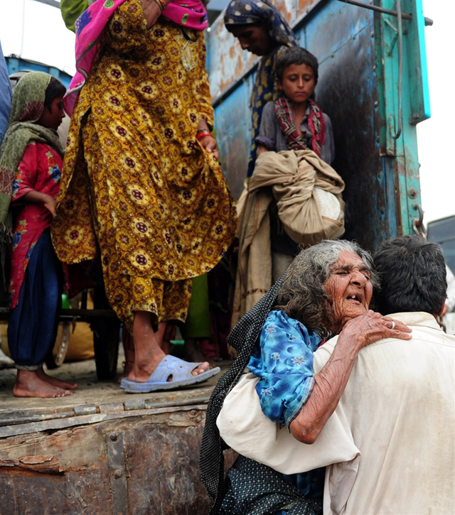 Flood victims in Pakistan, September 2011. Akhtar Soomro / REUTERS via hotpaknews.com