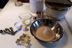 I've got whole wheat flour, salt, egg, milk, and a little bit of sugar...plus, a set of bone-shaped cookie cutters!