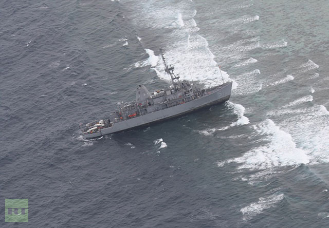 This handout photo taken on 17 January 2013 and released on 18 January 2013 by the Philippine Western Command (WESCOM) shows an aerial shot of the US Navy minesweeper USS Guardian after it ran aground on the Tubbataha Reef in the western Philippine island of Palawan. The US Navy minesweeper ran aground in a protected marine sanctuary in the Philippines, the US embassy in Manila said on 17 January 2013. Photo: AFP / WESCOM