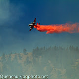 A heavy bomber from Neptune Aviation in Missoula attempts to douse the flames of the West Riverside Fire above Bonner on August 23, 2011.