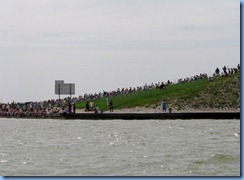 7955 private boat charter with Capt. Ron Presley  and his wife Karen - Banana River, Florida - crowds on side of State Road 528 waiting for final shuttle launch Atlantis