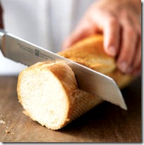 cutting bread with a knife