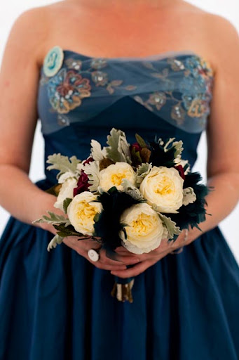 Stashia at the wedding, showing off her bouquet.