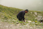 Our courteous driver picking flowers